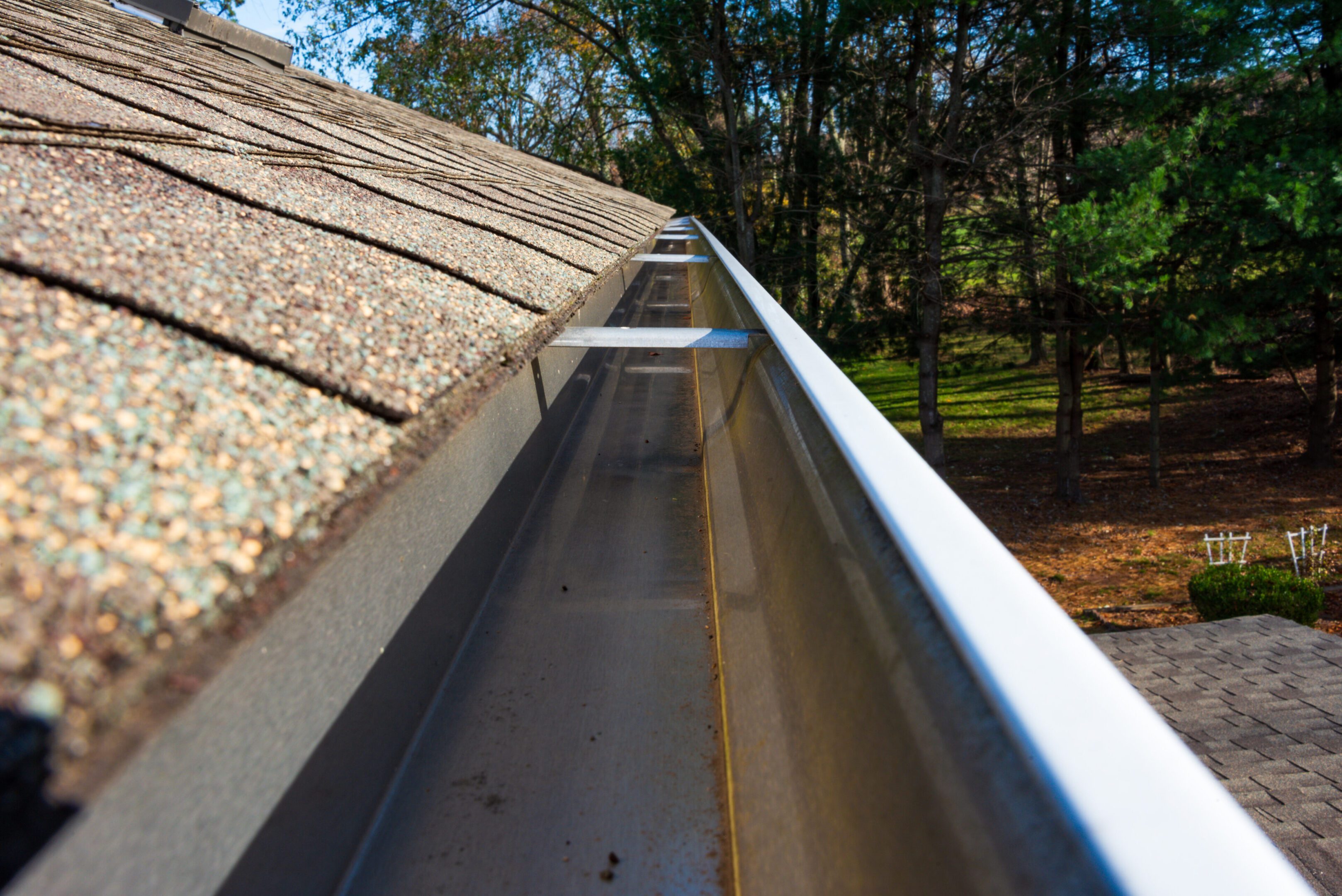 Cleaned gutters in front of the house, K style, No need to climb a ladder Cleaned gutters summer cleaning removed leaves, twigs, and debris. Aluminum gutters no overflows now nikon